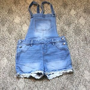 Denim jumpsuit that is a size L in youth girls.
